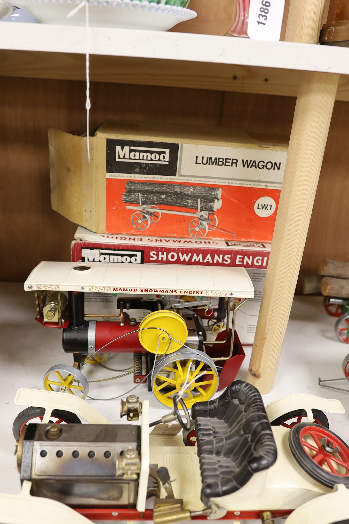 A boxed Mamod Showman's Engine and Lumbar wagon, and unboxed Steam Tractor and roadster- roadster 39 cms wide.